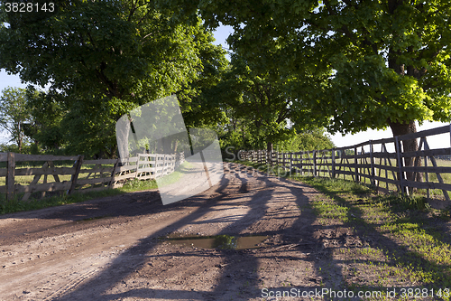 Image of rural road ,  fence