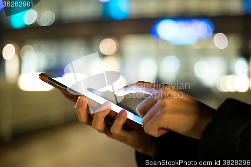 Image of Woman finger touch on blank screen of cellphone