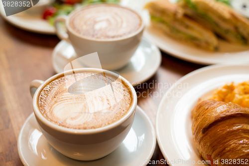 Image of Breakfast with coffee and croissants