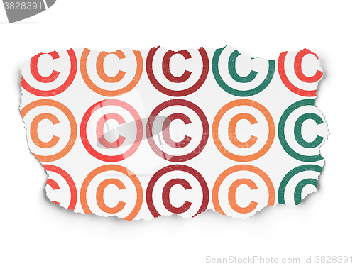 Image of Law concept: Copyright icons on Torn Paper background