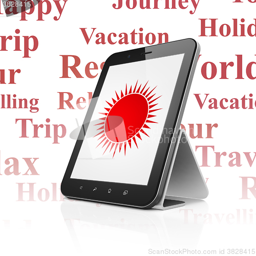 Image of Vacation concept: Tablet Computer with Sun on display