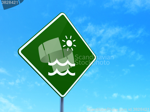 Image of Vacation concept: Beach on road sign background