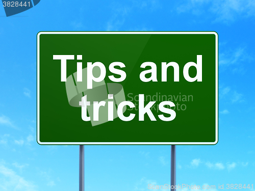 Image of Studying concept: Tips And Tricks on road sign background