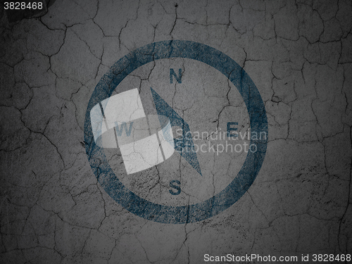 Image of Tourism concept: Compass on grunge wall background