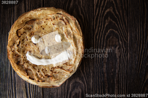 Image of Fried tasty smiling pancakes 