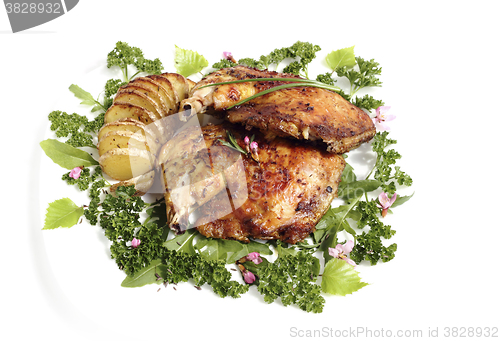 Image of Fried chicken thighs with roast potatoes hasselback