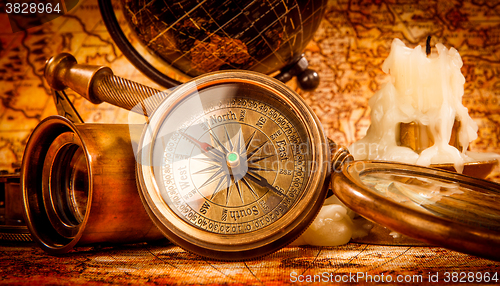 Image of Vintage still life. Vintage items on ancient map.