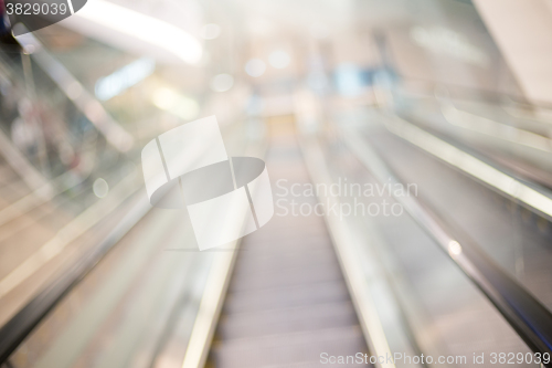 Image of Blur escalator in shopping mall with bokeh for background