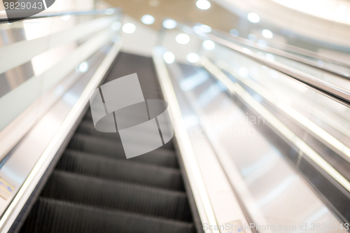 Image of Blurred image of escalator