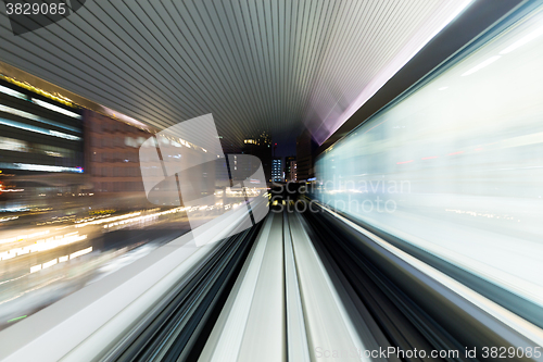 Image of Fast train through city