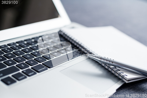 Image of Laptop and note book