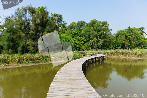 Image of Wooden footbridge across river