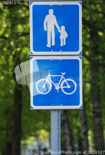 Image of Road sign bicycle path and pedestrian with children