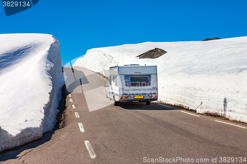 Image of Caravan car travels on the highway.