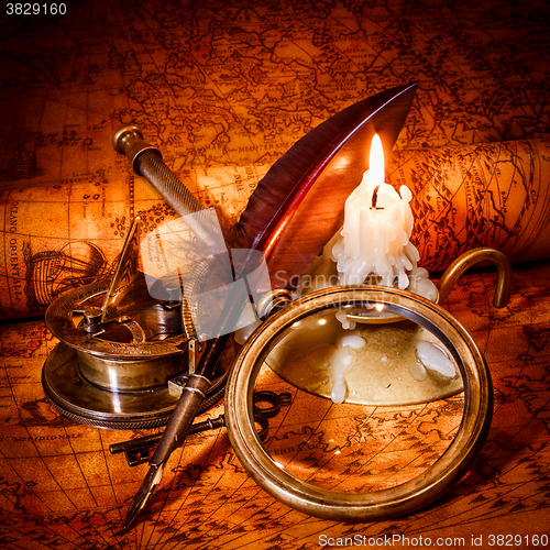 Image of Vintage still life. Vintage items on ancient map.