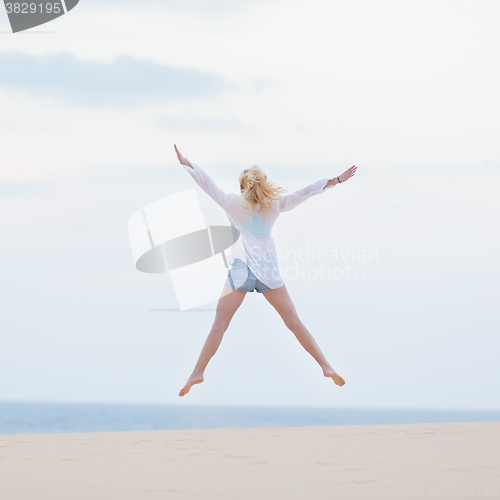 Image of Carefree woman enjoying freedom.