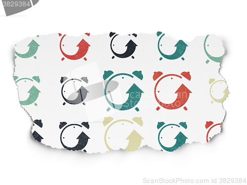 Image of Time concept: Alarm Clock icons on Torn Paper background