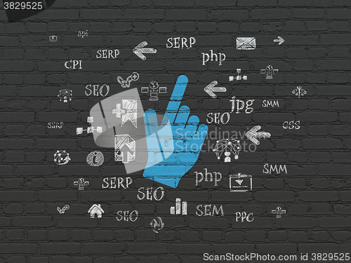 Image of Web development concept: Mouse Cursor on wall background