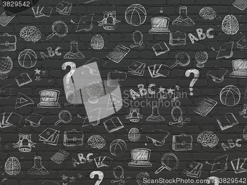 Image of Grunge background: Black Brick wall texture with Painted Hand Drawn Education Icons