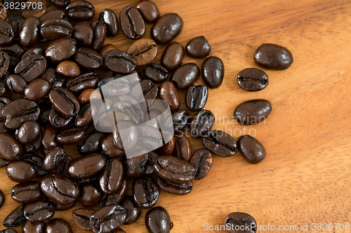 Image of Coffee bean over wooden background