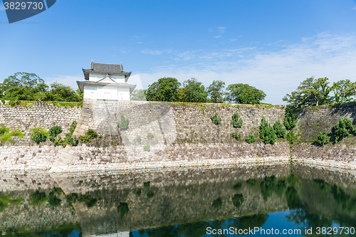 Image of Osaka Castle wall at riverside in Japan