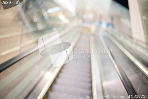 Image of Blur escalator in shopping store with bokeh for background