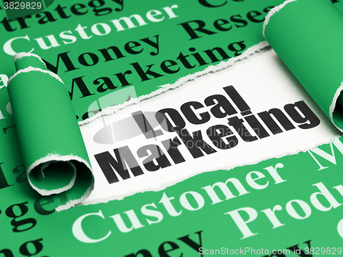 Image of Advertising concept: black text Local Marketing under the piece of  torn paper
