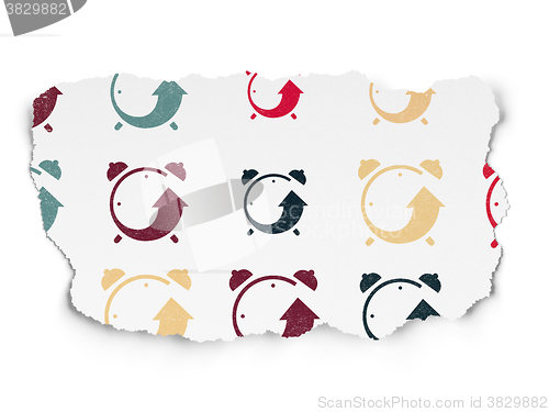 Image of Time concept: Alarm Clock icons on Torn Paper background