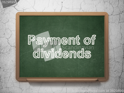 Image of Currency concept: Payment Of Dividends on chalkboard background