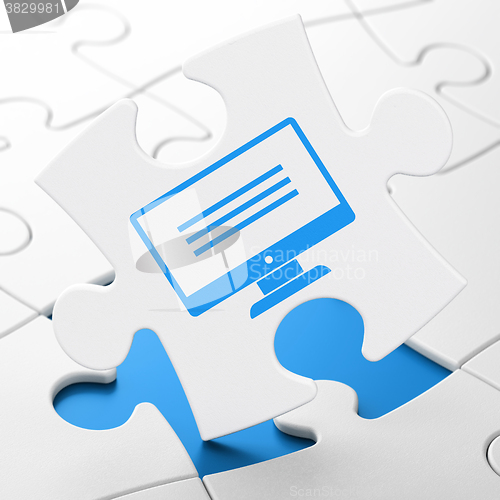 Image of Web design concept: Monitor on puzzle background