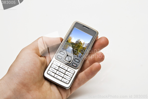 Image of Mobile on a hand