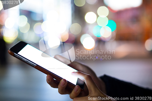 Image of Woman using her mobile phone
