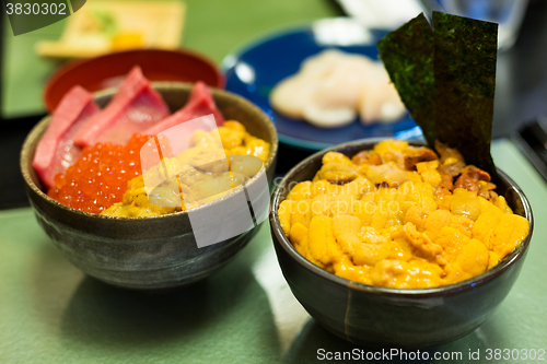 Image of Japanese bowl of rice, Tuna, roe and sea urchin 