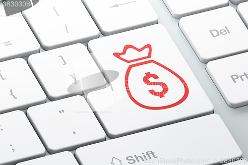 Image of Banking concept: Money Bag on computer keyboard background