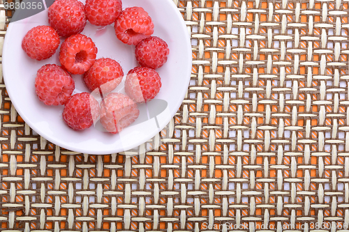 Image of Big Pile of Fresh Raspberries in the White Bowl
