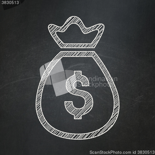 Image of Currency concept: Money Bag on chalkboard background