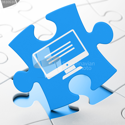 Image of Web development concept: Monitor on puzzle background