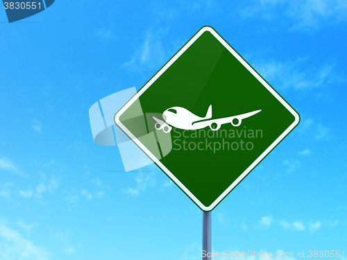 Image of Tourism concept: Airplane on road sign background