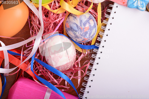 Image of Easter background with eggs, ribbons and spring decoration