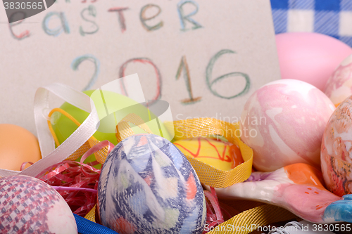 Image of Easter background with eggs, ribbons and spring decoration