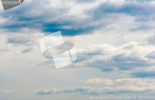 Image of blue sky background with tiny clouds