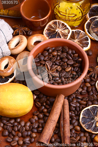 Image of coffee beans and candle. lemon and cinnamon. anise and aroma spice