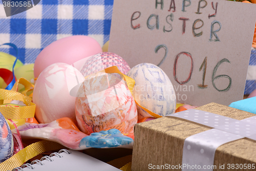 Image of Easter background with eggs, ribbons and spring decoration
