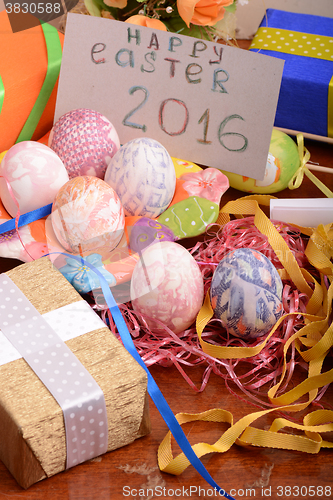 Image of Easter background with eggs, ribbons and spring decoration