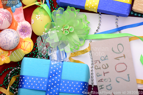 Image of Easter background with eggs, ribbons and spring decoration