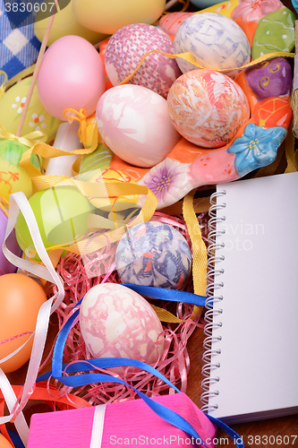 Image of Easter background with eggs, ribbons and spring decoration