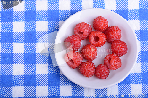 Image of Big Pile of Fresh Raspberries in the White Bowl