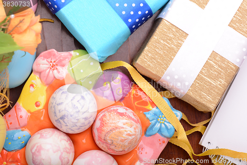 Image of Easter background with Easter eggs and gift box