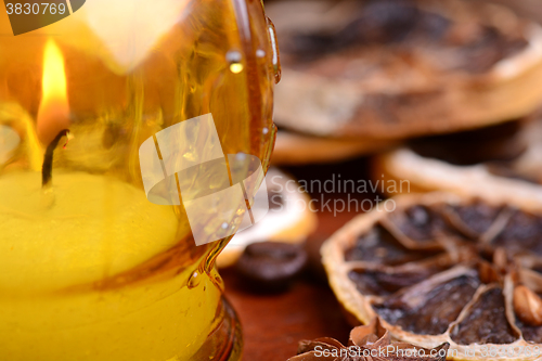 Image of coffee beans and candle lemon on old vintage background