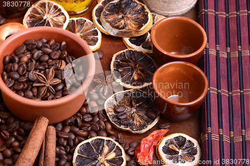 Image of coffee beans and candle. lemon and cinnamon. anise and aroma spice